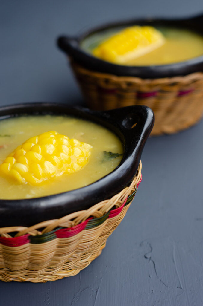 two traditional bowls of colombian potato corn soup without the toppings