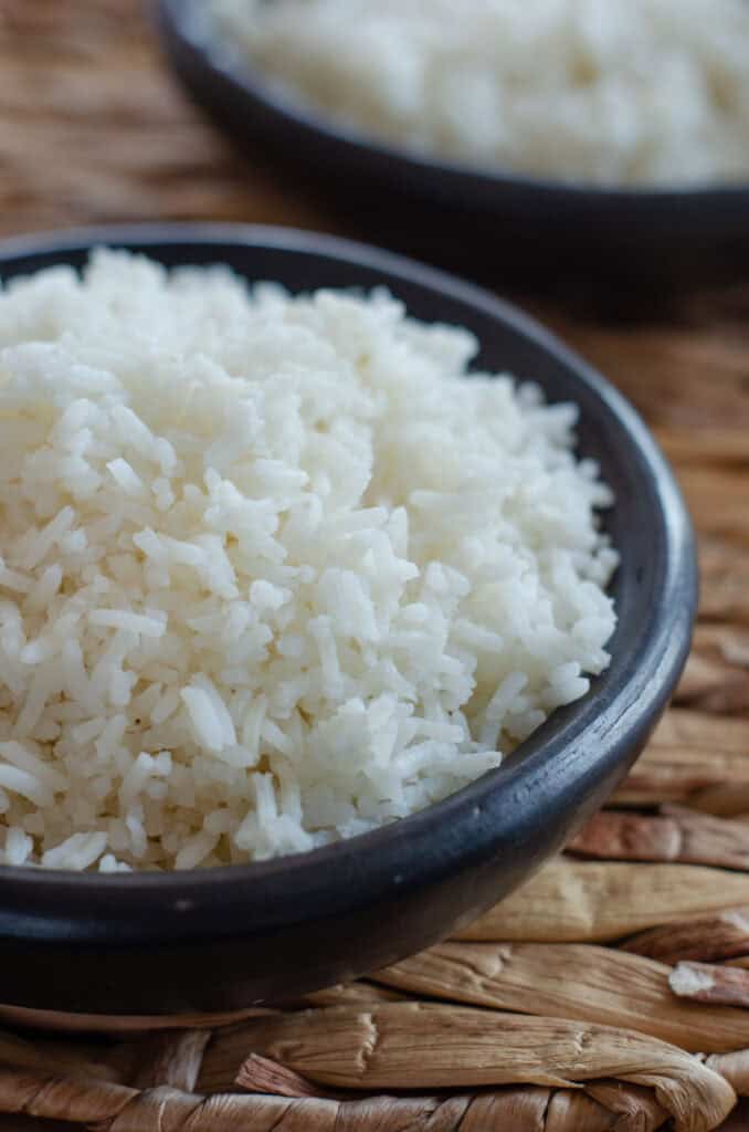 close up of a black bowl with white rice