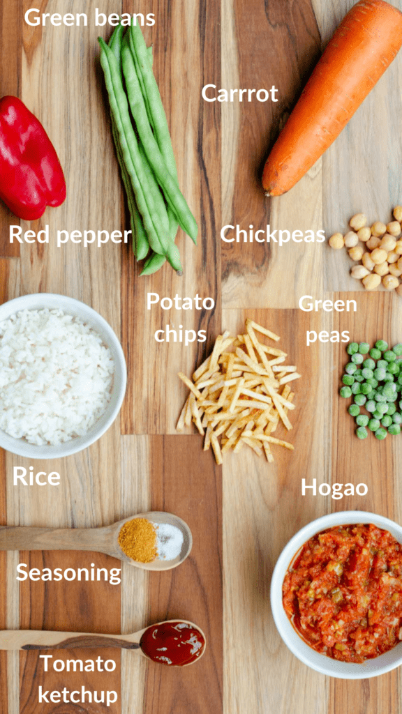ingredients of rice with vegetables: rice, carrot, green beans, green peas, red pepper, hogao, spices, tomato ketchup and potato chips