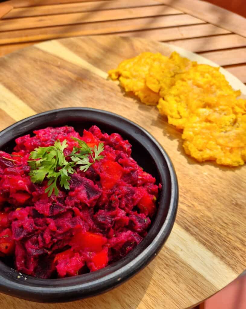 colombian beetroot salad on a table with fried green plantains