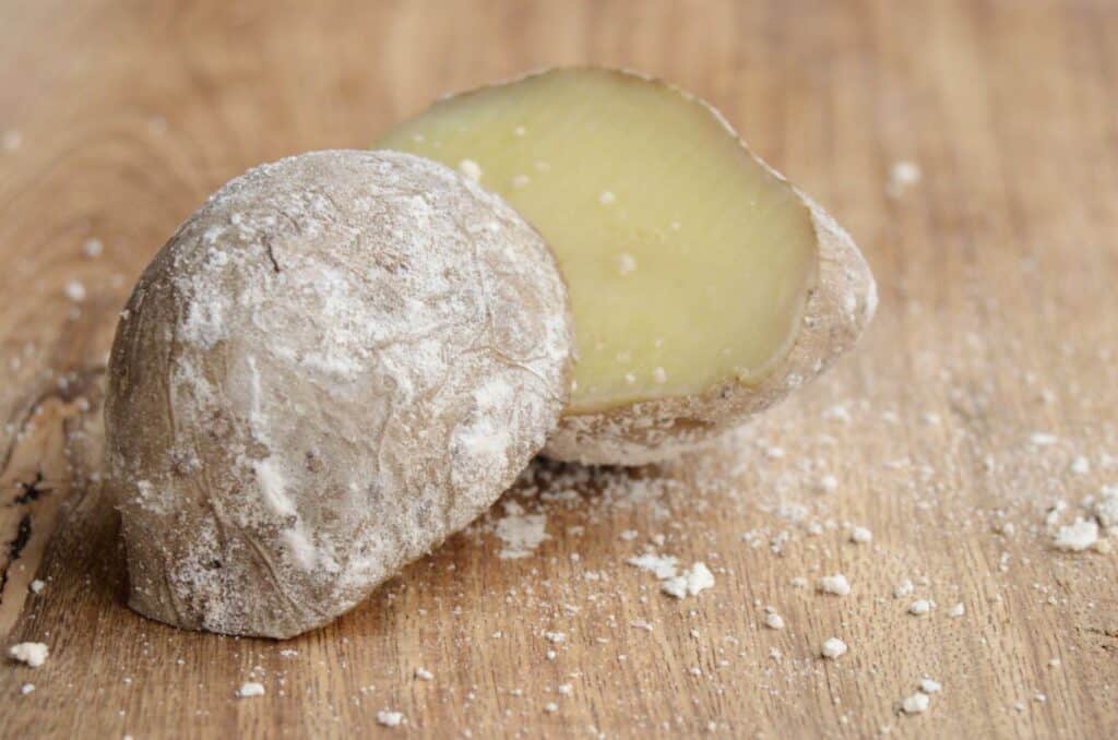 close up of a potato  with salt crust cut in half