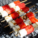 skewers with white cheese and watermelon on a bbq grill
