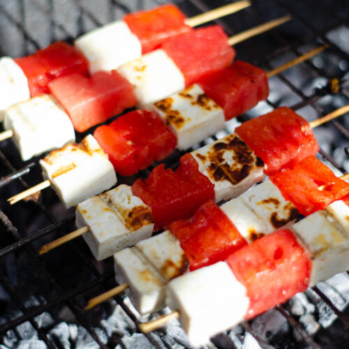 skewers with white cheese and watermelon on a bbq grill