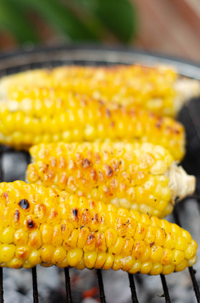 corn on the cob grilling and charring on the bbq grill