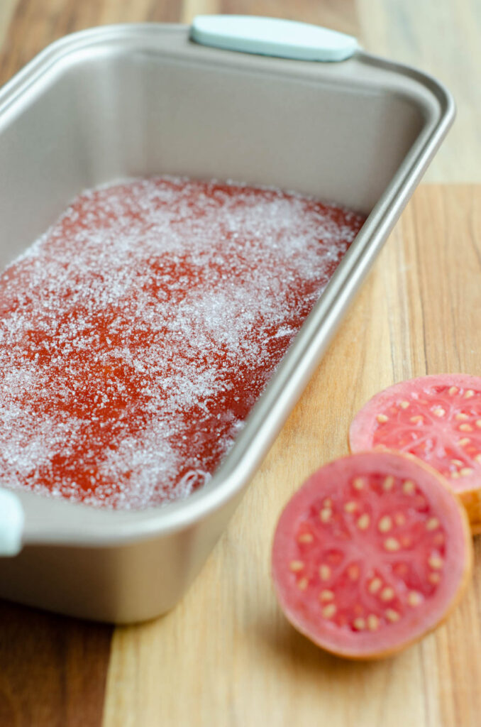 guava paste sprinkled with sugar in a baking tin