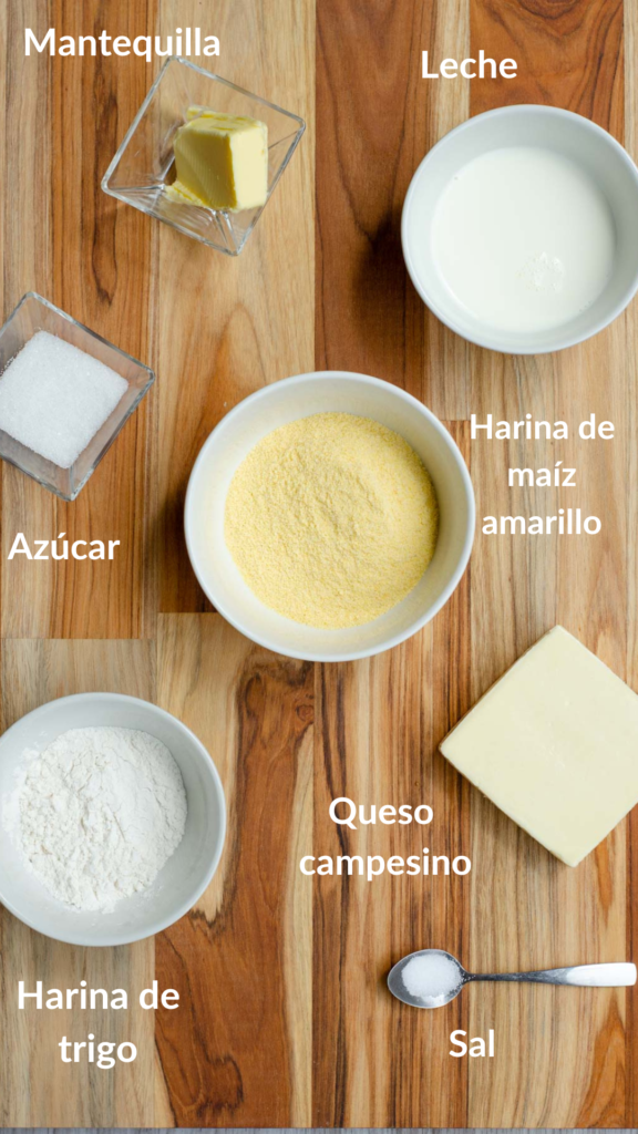los ingredientes de las arepas en la mesa: harina de maiz, harina de trigo, leche, mantequilla, azucar, sal, queso campesino