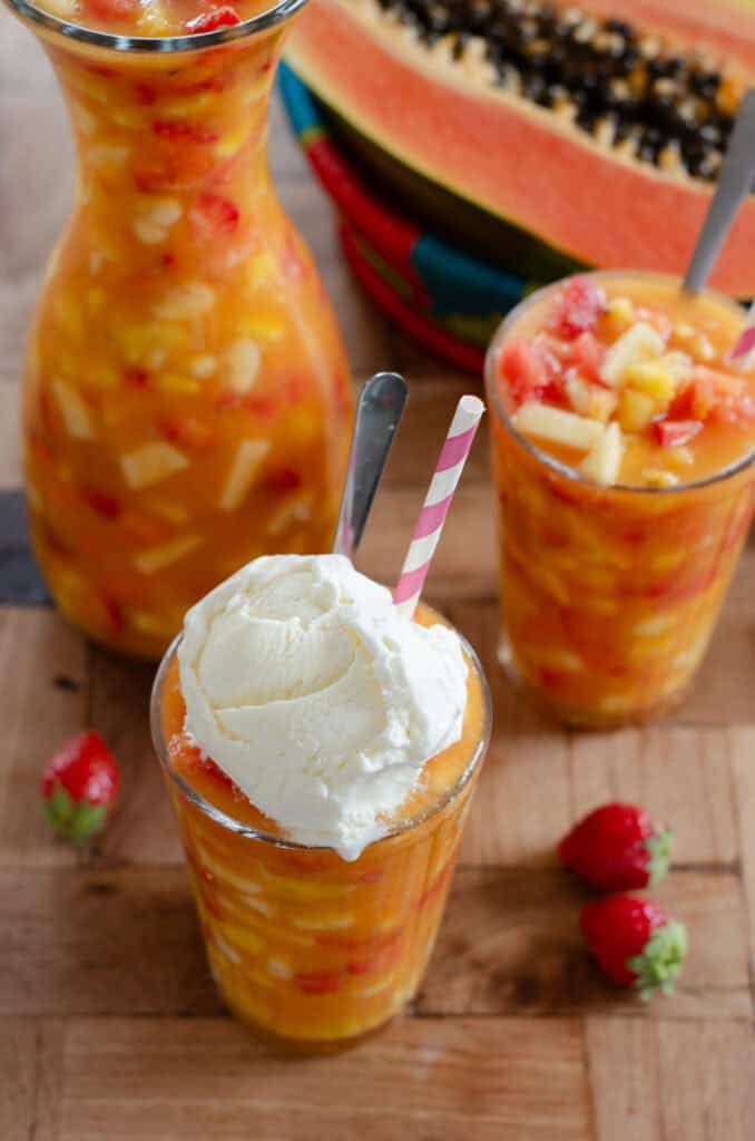 glass of salpicon the frutas with vanilla ice cream, and another glass of salpicon without ice cream